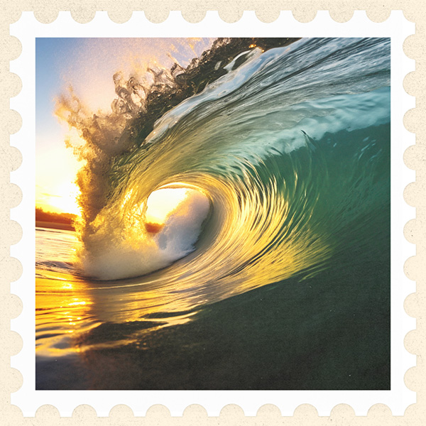 Close-up image of an ocean wave barreling towards the shore